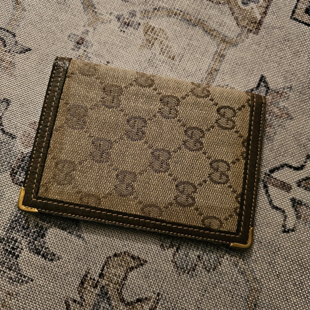 Gucci Brown and Tan Wallet in used condition